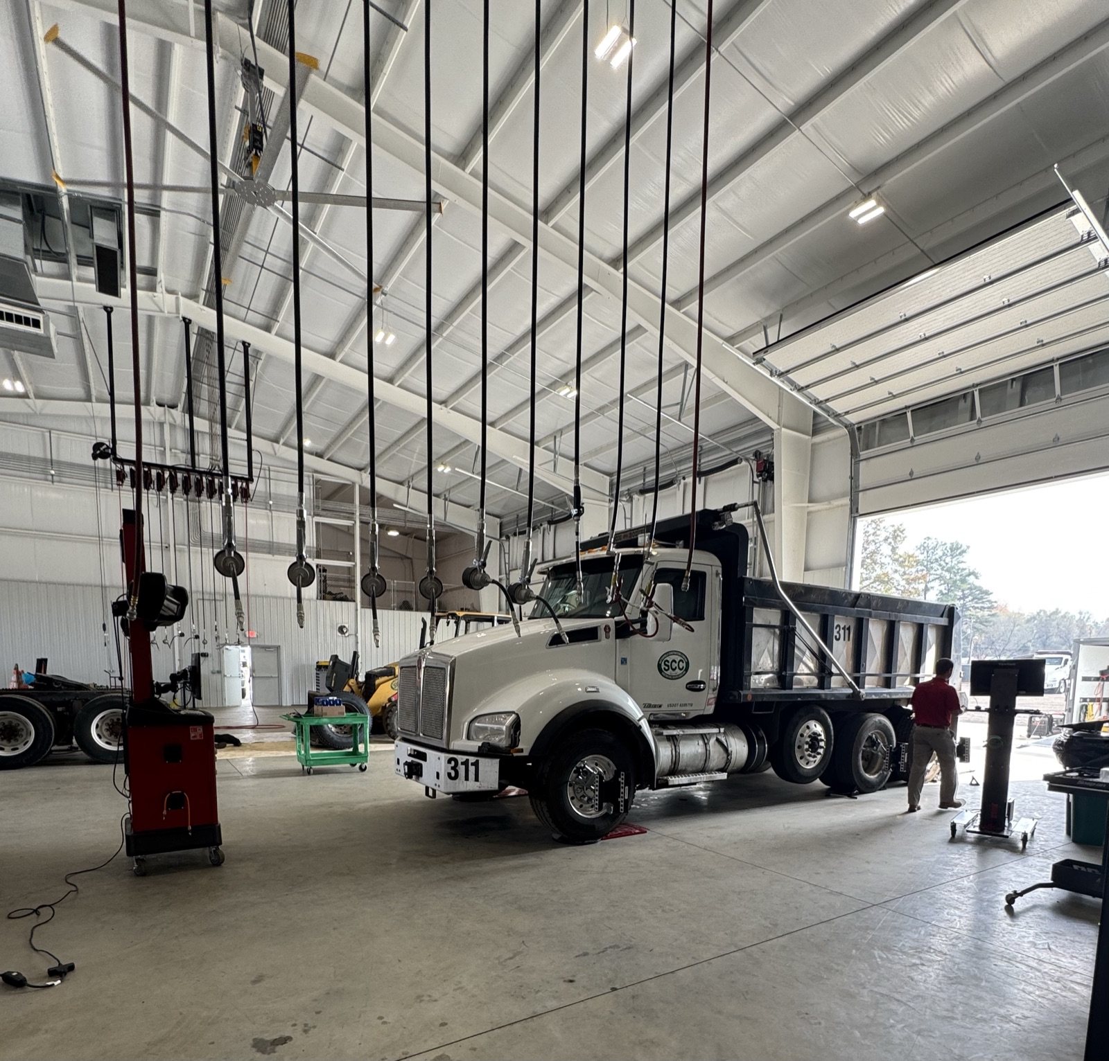 Municipal dump truck in a Hunter HD alignment bay